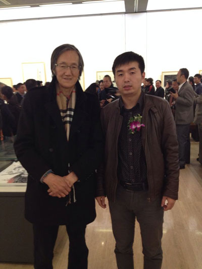 中国版画院长王炜与《艺术天成》杂志社市场部经理林少云合影