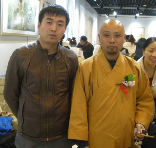 中国画艺术研究院常务副院长演旭与《艺术天成》市场部经理林少云合影