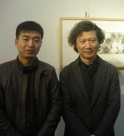 中国美术家协会《美术》杂志执行主编尚辉与《艺术天成》市场部经理林少云合影