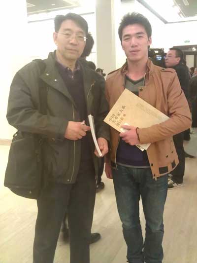 中国美术家协会会员傅以新与记者程兵合影
